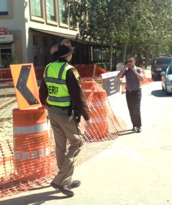 "Now hold it right there, young whippersnapper, you're in vi-o-lation of Code 147: The Texas Ten Gallon. Where on god's green earth is your hat?"