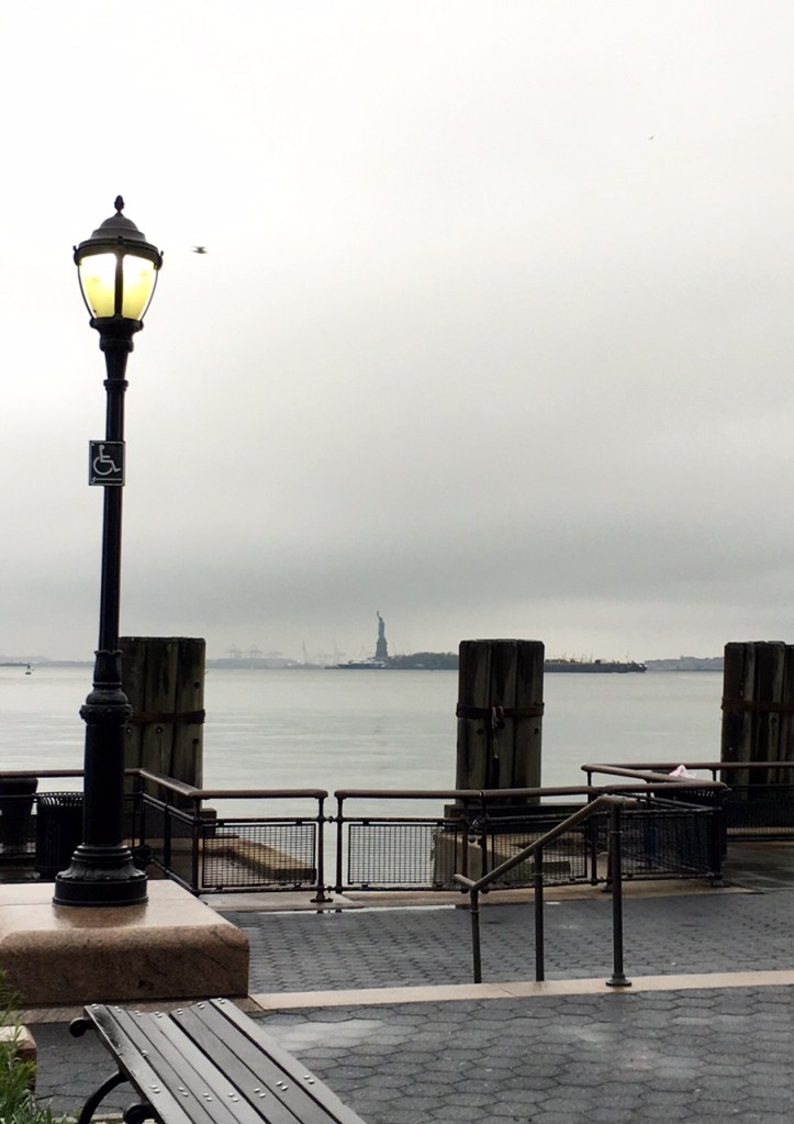 Greaaaattt big lamp post. Teeeeeeny tiny Statue of Liberty.
